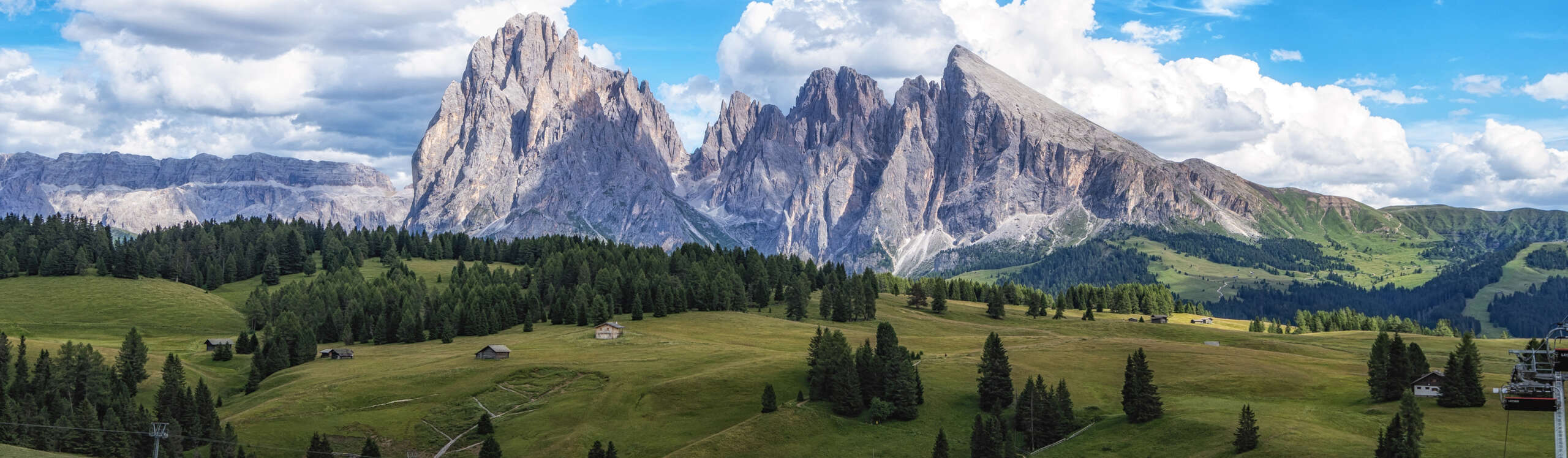 Alpe di siuss or seiser alm alpine meadows view with langkofel mountains in the background. Taken in Dolomites, Italy